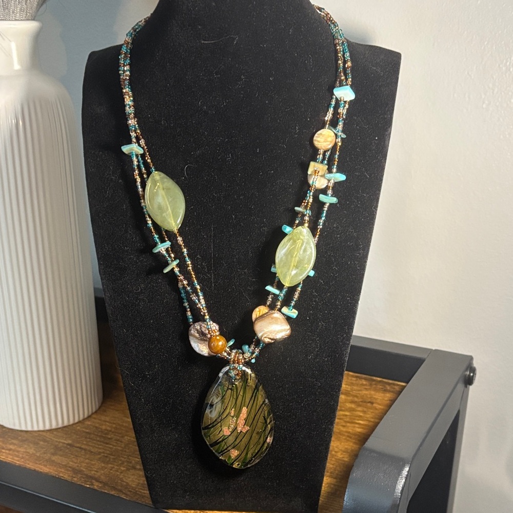 Handcrafted multi-strand Beaded Necklace with dichroic large glass pendant.